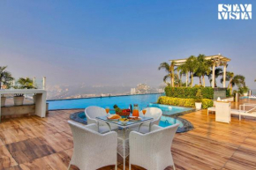 StayVista's Skyline Studio Apartments - Urban Oasis with Terrace, Gym & Bar